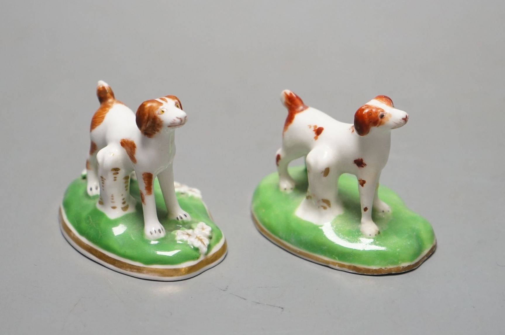 Two Chamberlains porcelain toy models of a pointer, c.1847-52, one with leaf moulded flat base, impressed CHAMBERLAINS, the other with plain concave base and unmarked, cf. Dennis G.Rice, Dogs in English porcelain, colour